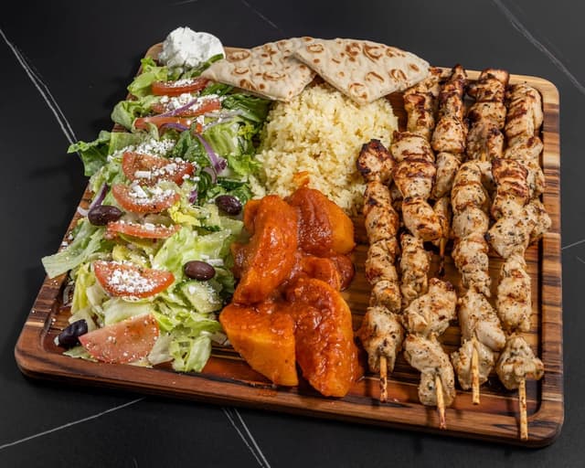 Family Meal prepared by Greek Mansion