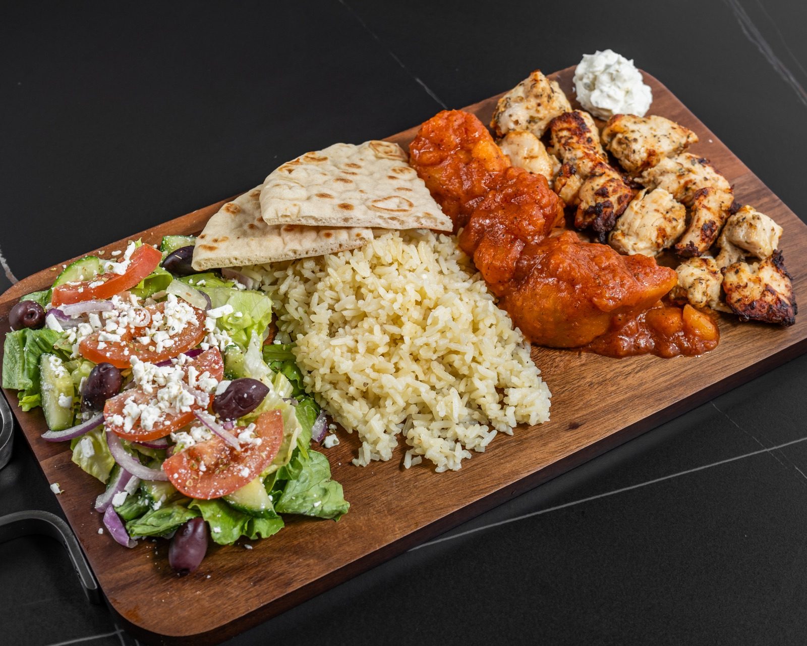 Greek Mansion steak dinner with Greek salad, rice, potatoes, pita and tzatziki